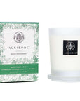 Monterey Pine candle by Aquiesse, featuring a sleek design and holiday-themed packaging with pine graphics.