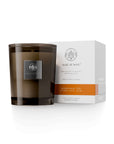 Mandarin Tea candle by Aquiesse in a brown glass container, accompanied by an elegant packaging box.