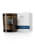 Moonlit Petals Candle by Aquiesse with notes of jasmine, gardenia, and musk, presented in an elegant glass jar.