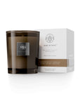 Sandalwood Vanilla Candle by Aquiesse in a sleek glass jar with a white box, featuring notes of sandalwood, vanilla, and musk.