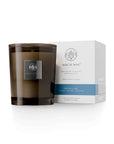 Aquiesse Shoreline candle in a chic glass jar, paired with elegant packaging, capturing coastal scents.