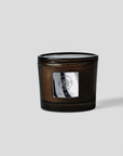 Passion Fruit Citrus Candle in a stylish amber jar, evoking tropical vibes of island living and fresh citrus scents.