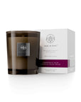 Grapefruit Acai candle in brown glass jar with white box, featuring fresh grapefruit, acai berry, and balsam vanilla scent.