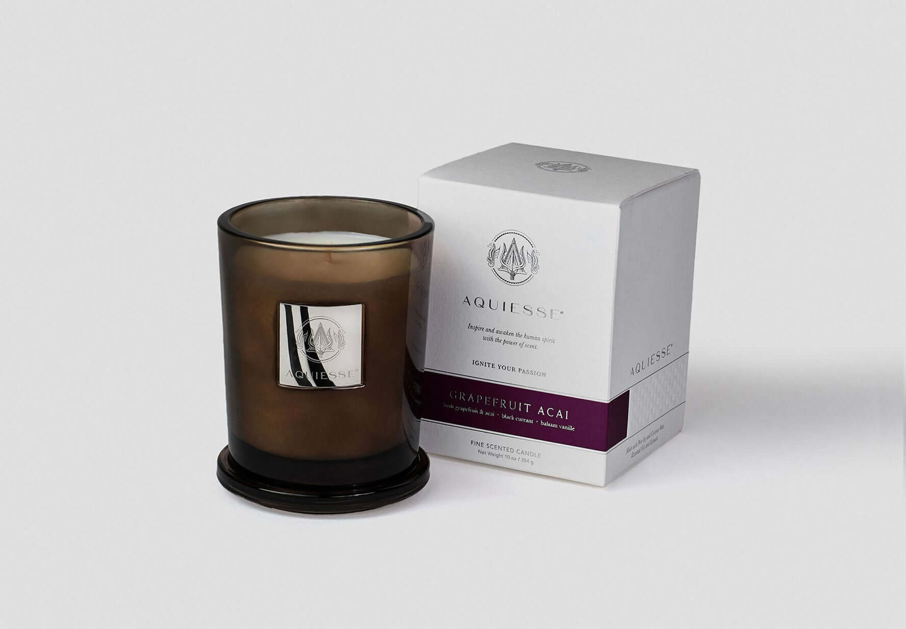 Grapefruit Acai scented candle in a glass jar with box packaging, featuring tropical scents of grapefruit and acai berry.